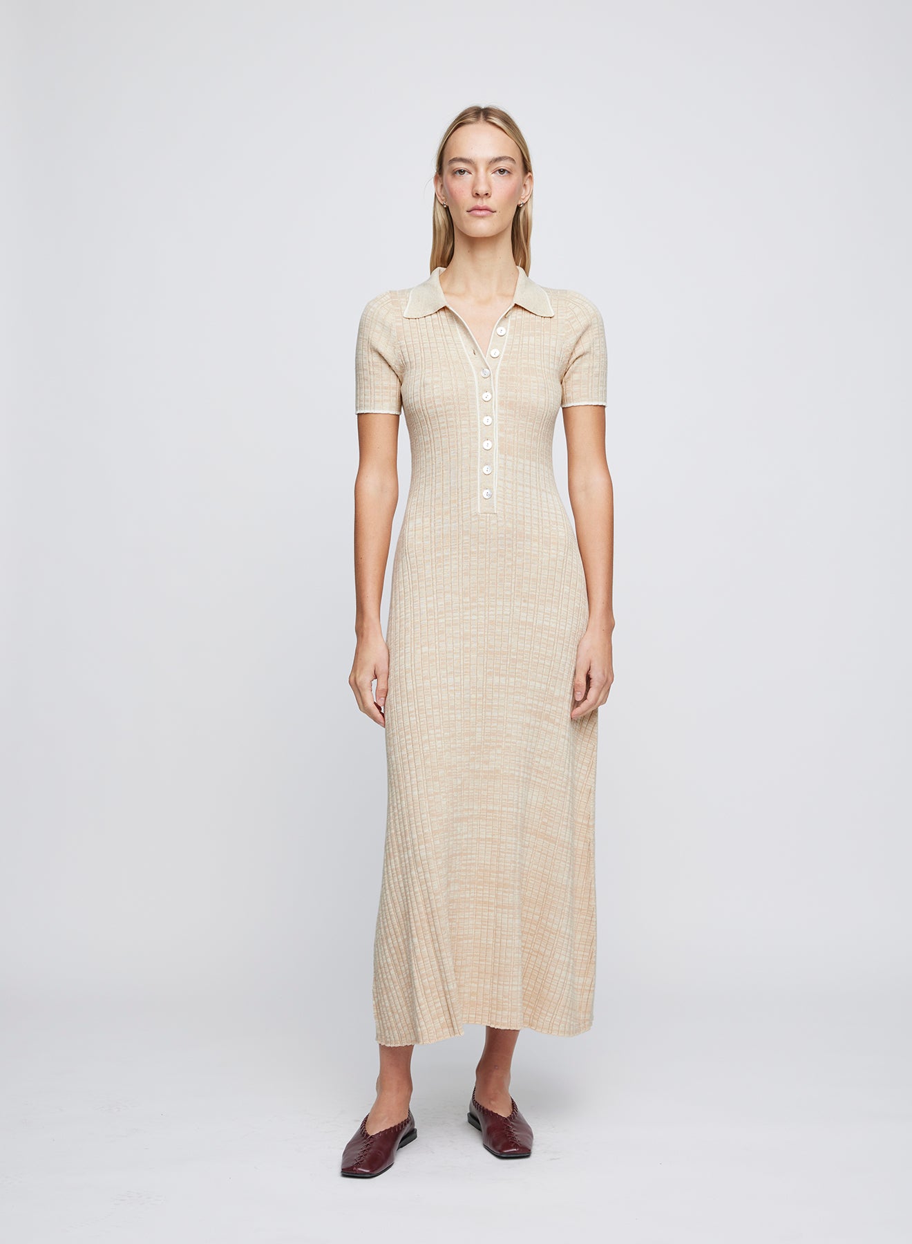 The ANNA QUAN Penelope Dress in Sand Dune is the dress for any occasion, designed in a soft 100% cotton rib that stretches and sculpts the body. Designed with a polo inspired button placket and contrast trimming.