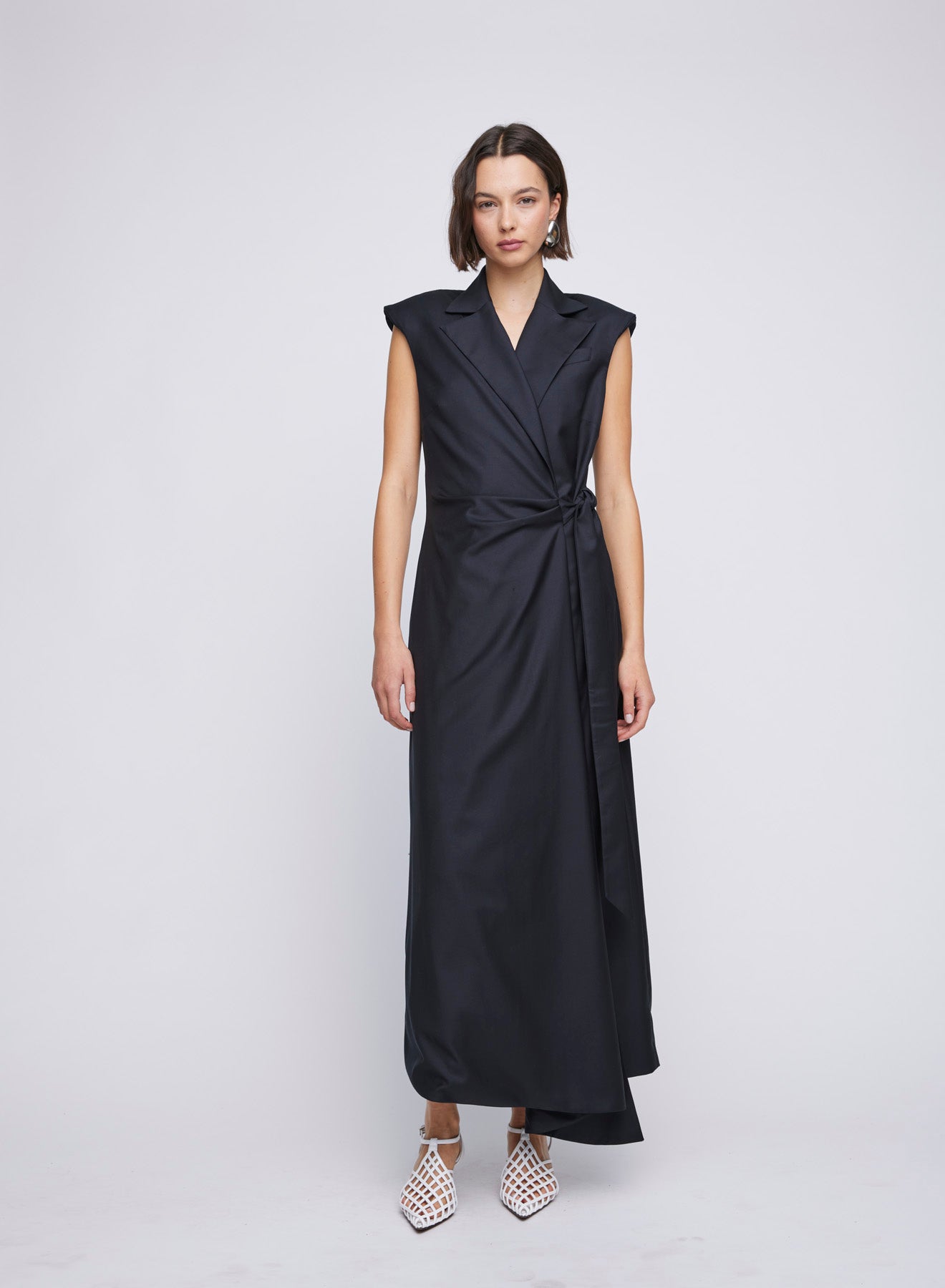 ANNA QUAN Victoria Dress in wrap tailored style. Waist-cinching tie, shoulder pads, v neckline. Ideal for an elegant office-to-dinner ensemble.