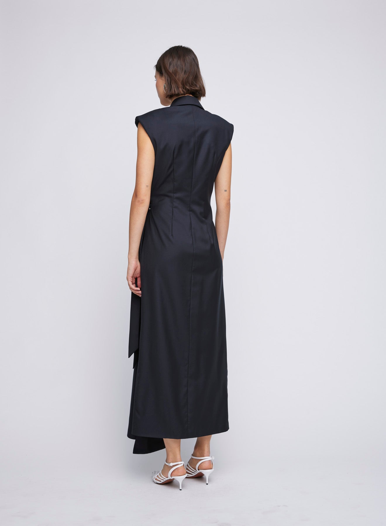 ANNA QUAN Victoria Dress in wrap tailored style. Waist-cinching tie, shoulder pads, v neckline. Ideal for an elegant office-to-dinner ensemble.