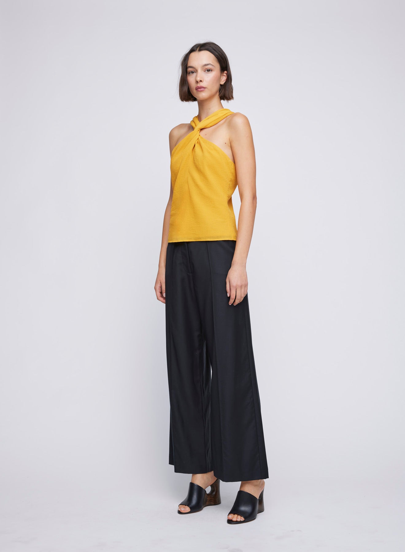 ANNA QUAN Halter Top in textured woven suiting fabric. Halter neckline, shaped waist seam, fully lined. Ideal for a versatile day-to-night look.