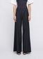 ANNA QUAN's wardrobe staple Wide Leg Tailored Pants, feature a classic button, zip fastening and belt loops. Designed to sit on the waist and the leg hem skimming the floor. Tailored pants, work pants, everyday pants, black work pants, tailored wool pants.