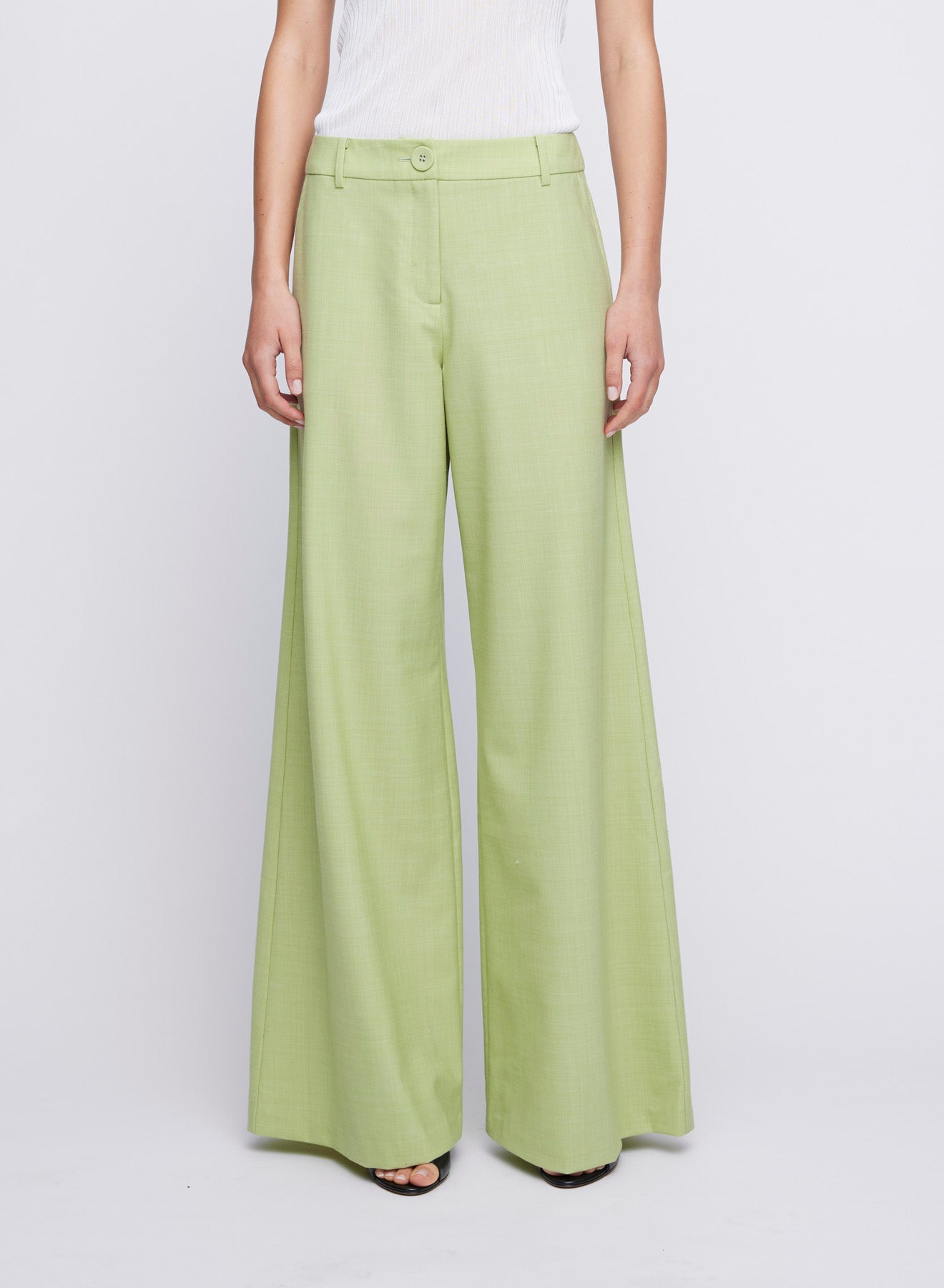ANNA QUAN's wardrobe staple Wide Leg Tailored Pants, feature a classic button, zip fastening and belt loops. Designed to sit on the waist and the leg hem skimming the floor. Tailored pants, work pants, everyday pants, colourful work pants, tailored wool pants.