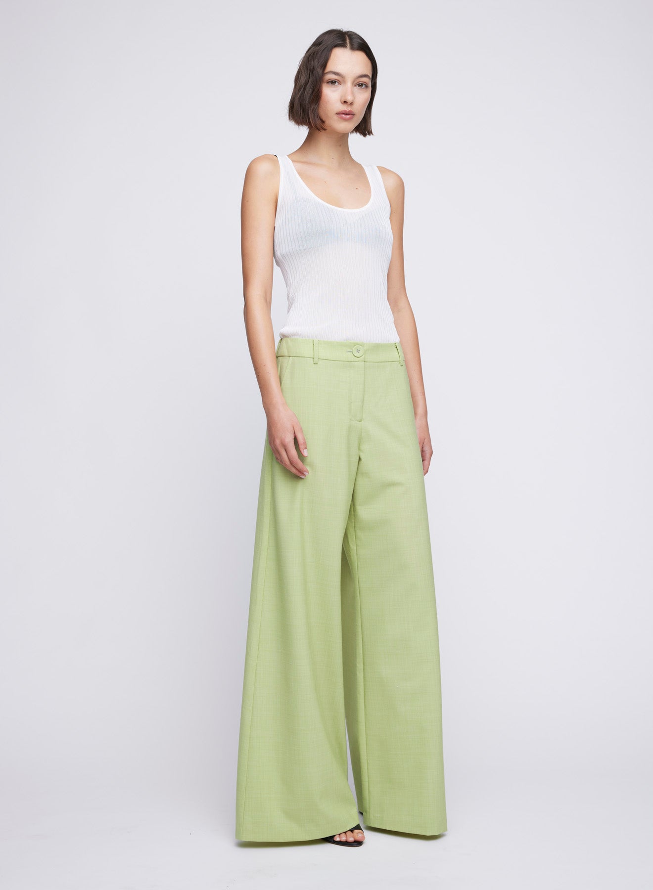 ANNA QUAN's wardrobe staple Wide Leg Tailored Pants, feature a classic button, zip fastening and belt loops. Designed to sit on the waist and the leg hem skimming the floor. Tailored pants, work pants, everyday pants, colourful work pants, tailored wool pants.