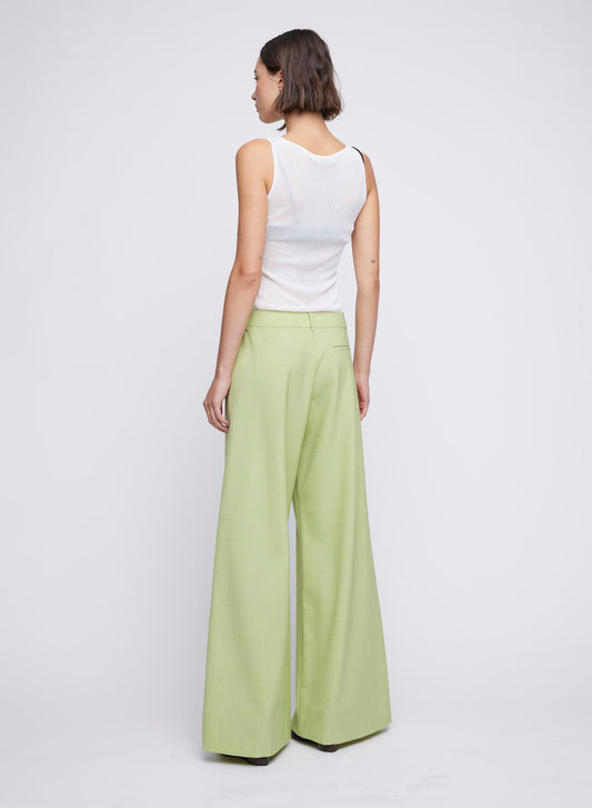 ANNA QUAN's wardrobe staple Wide Leg Tailored Pants, feature a classic button, zip fastening and belt loops. Designed to sit on the waist and the leg hem skimming the floor. Tailored pants, work pants, everyday pants, colourful work pants, tailored wool pants.