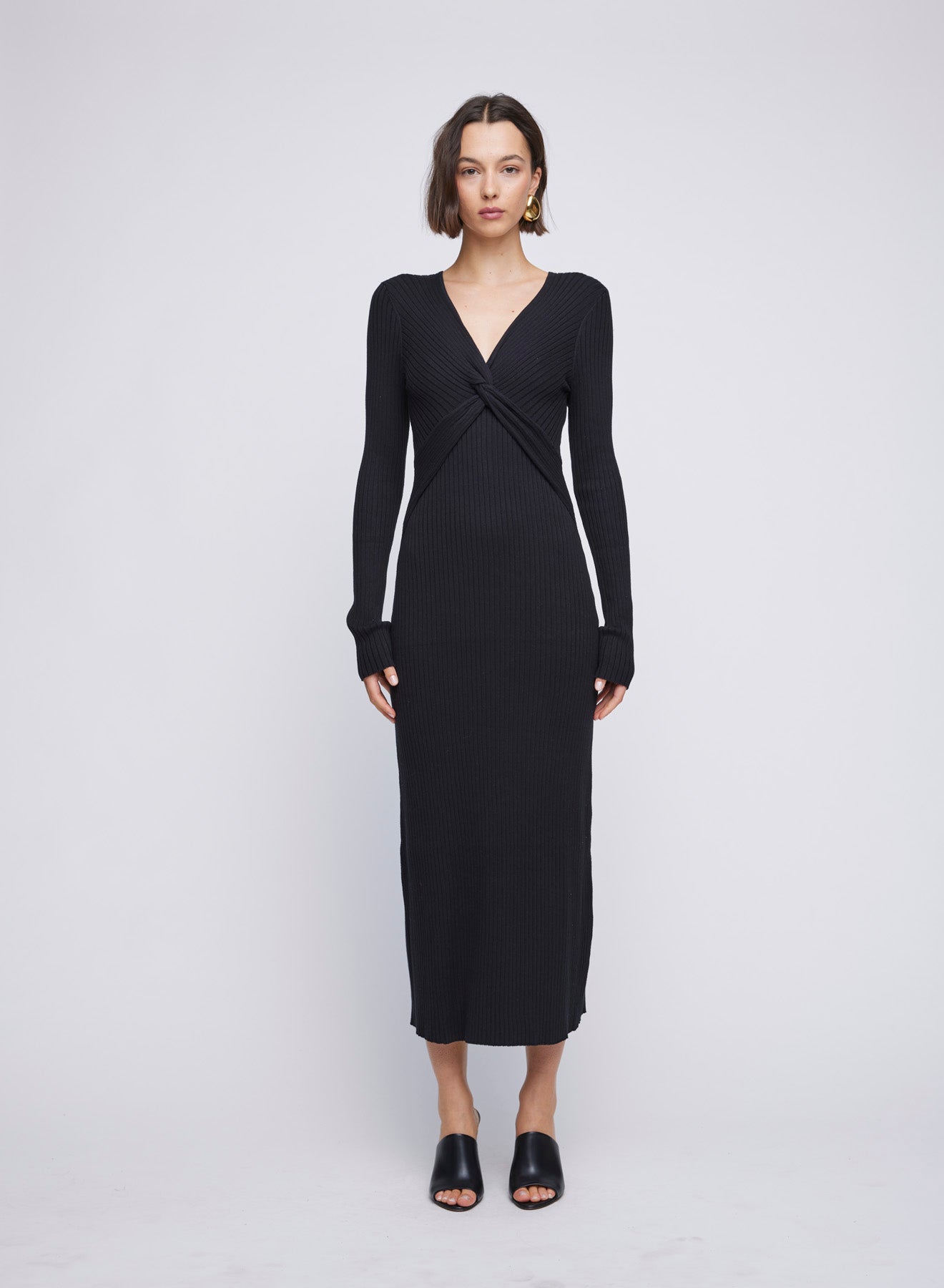 Long Sleeve ANNA QUAN Knit Maxi Dress, featuring a centre front twist, long sleeves and hem finishing just above the ankle. Elevate your everyday style with this chic and comfortable piece. Day dress, work dress, dress for work, winter dress, everyday dress, black knit dress, black long sleeve dress.