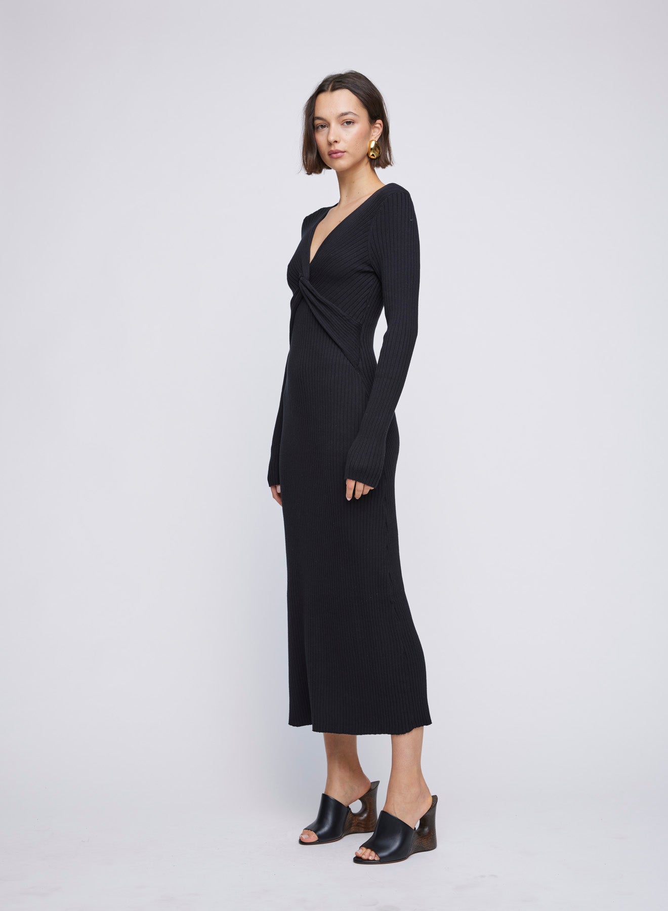 Long Sleeve ANNA QUAN Knit Maxi Dress, featuring a centre front twist, long sleeves and hem finishing just above the ankle. Elevate your everyday style with this chic and comfortable piece. Day dress, work dress, dress for work, winter dress, everyday dress, black knit dress, black long sleeve dress.