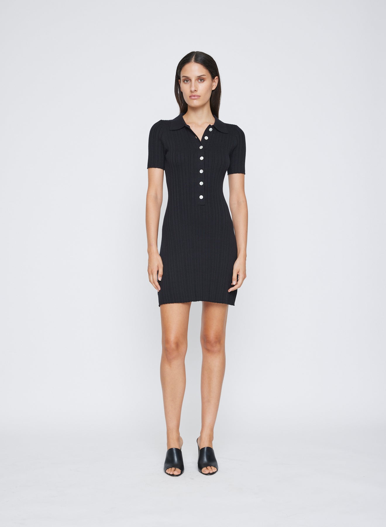 ANNA QUAN's Rib Knit Cotton Mini Dress features a chic polo neckline and contrasting buttons. Embrace versatility and comfort effortlessly with this best-selling piece, perfect for seamless transitions throughout the seasons. Day knit dress, day dress, everyday dress, work dress, short sleeve dress, short knit dress.