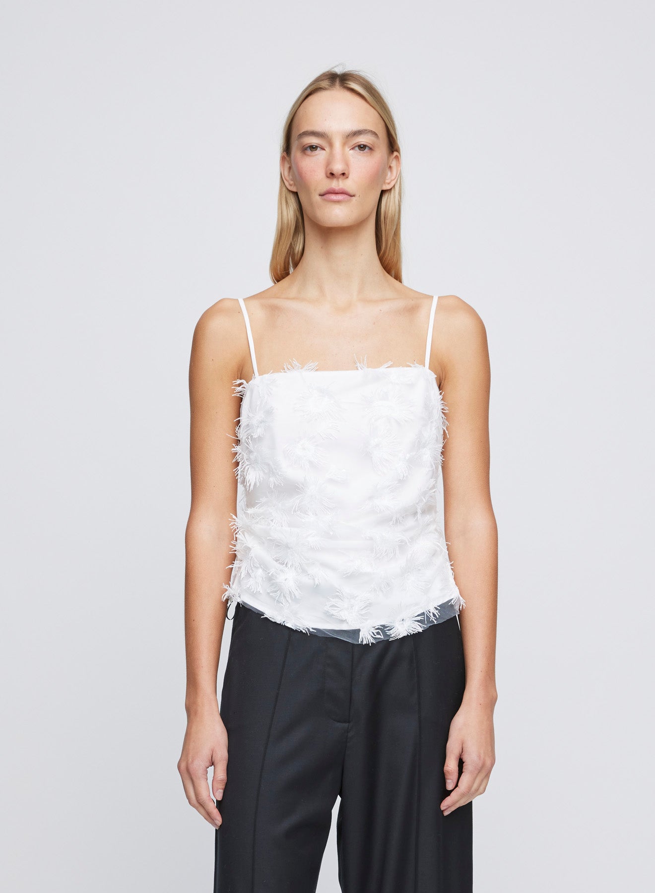 The ANNA QUAN Nadine Top is crafted in a Dandelion fabric. This fully lined, cropped in length top is lightweight and easy to wear. Detailed with a raw hem finish and a delicate square neckline.  